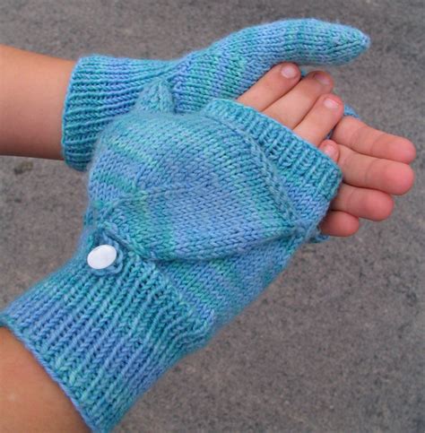 Flip mittens come in a wearable neutral hue. Nelkin Designs- Knitting Patterns