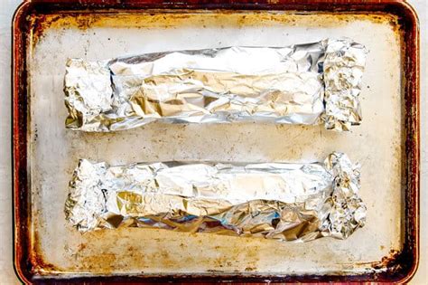 Line a sheet pan with aluminum foil. BEST Baked Pork Tenderloin with Garlic Herb Butter (+Video!)