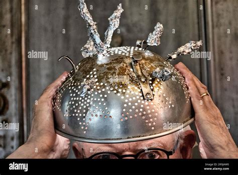 Man wearing tinfoil hat due to the superstition of extraterrestrial