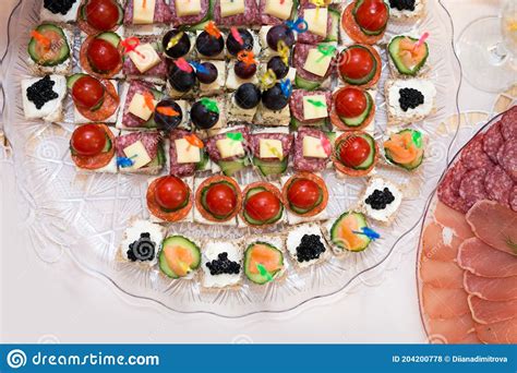 The Buffet At The Reception Assortment Of Canapes On A Table Banquet