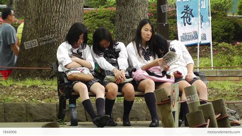 Japanese Schoolgirls Relaxing In Park In Yokohama Japan Stock Video