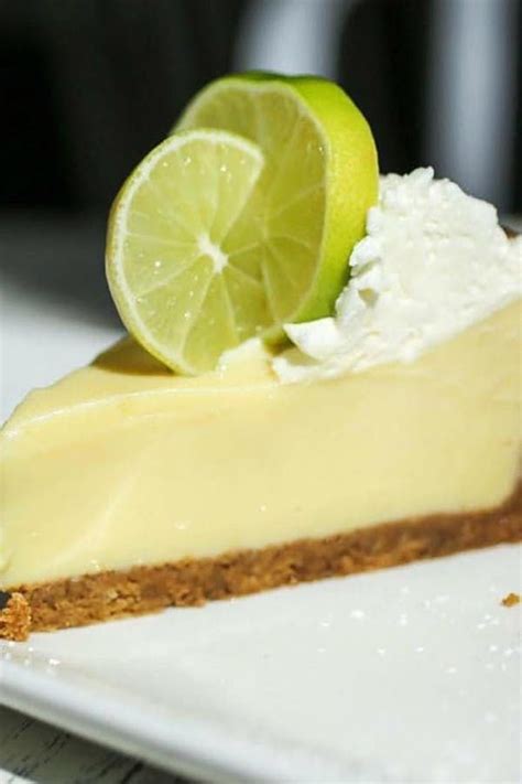 A Slice Of Lime Pie On A White Plate