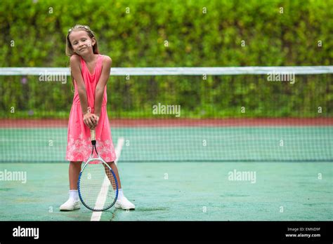Little Girl Playing Tennis On The Court Stock Photo Alamy