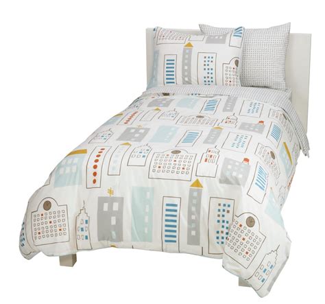 Set includes a reversible comforter, fitted sheet, flat sheet, and pillowcase. Stylish modern toddler boy bedding