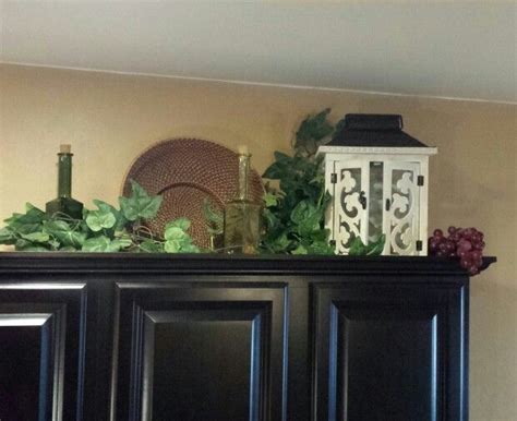 Decorating above your cabinets is a great way to showcase favorite items and keep the supplies you need within reach. Tuscan decor... above cabinets | Tuscan decorating ...