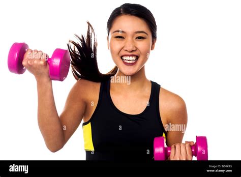 Cheerful Young Girl Exercising With Dumbbells Stock Photo Alamy