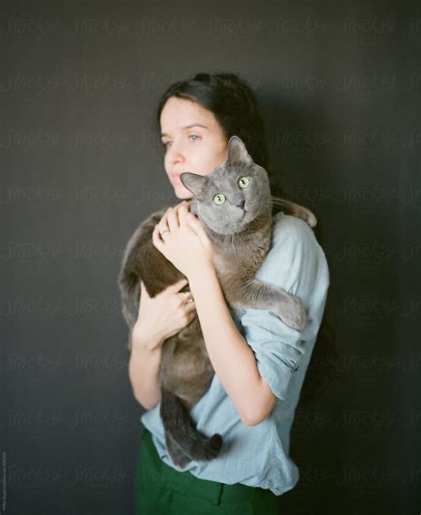 Woman Holding Cat Del Colaborador De Stocksy Milles Studio Stocksy