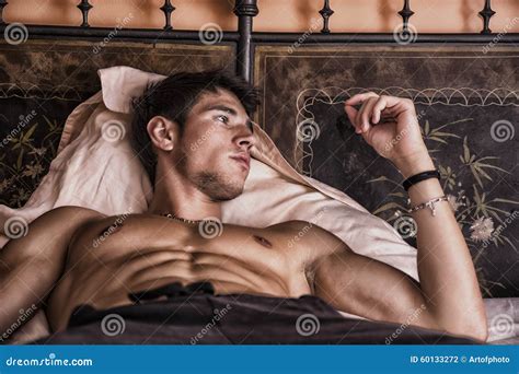 Shirtless Male Model Lying Alone On His Bed Stock Photo Image Of