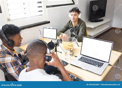 Image Of Happy Diverse Teenage Boys With Headphones And Laptops With