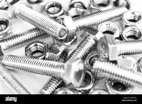 Metal Bolts And Nuts In A Row Background Chromed Screw Bolts And Nuts