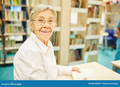 Old Woman As A Librarian In A Library Stock Image Image Of Retirement