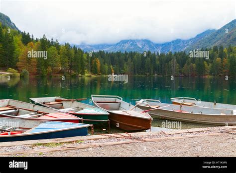 Beautiful Lago Di Fusine The Mountain Lake At Boat And Mangart Mountain