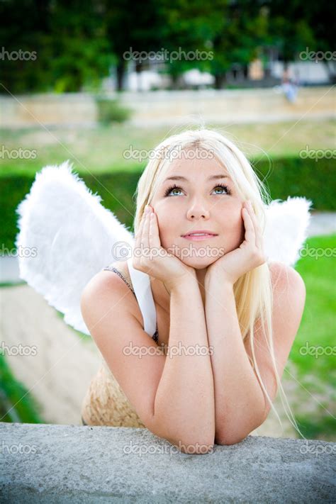 Beautiful Blonde Angel Girl Smling In The Park Stock Photo By ©lisiza
