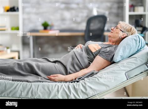Old Granny Sleeping In A Modern Nursing Home Room Retired Woman Stock