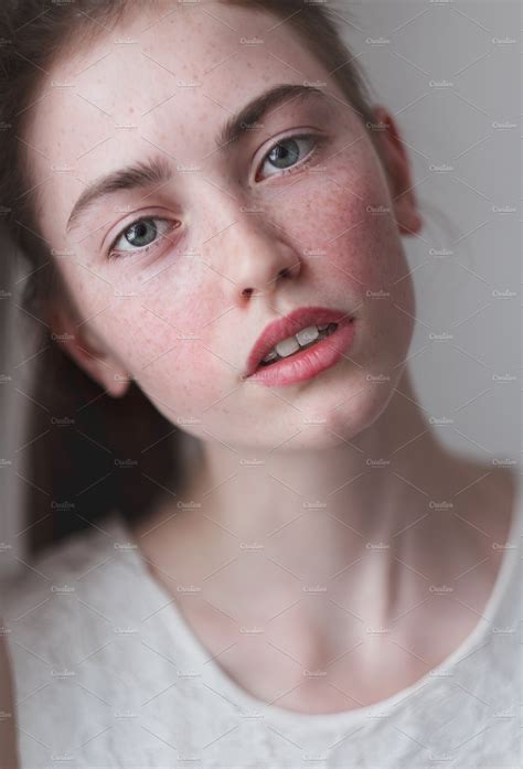 A Young Girl With Freckles High Quality Beauty And Fashion Stock Photos