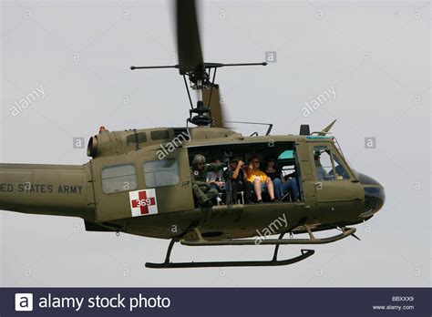 A Vietnam Era Uh 1 Huey Helicopter Flies During A Vietnam