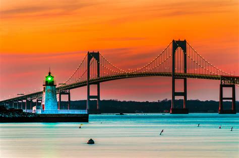 Sunset Over Lighthouse And Bridge In Newport Rhode Island