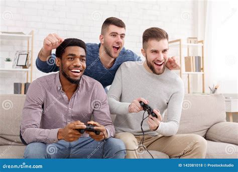 Gamers Happy Men Playing Video Games At Home Stock Photo Image Of