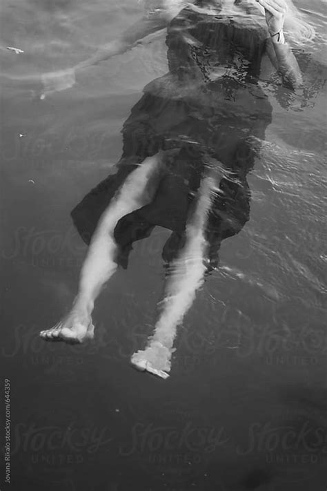Young Woman Floating On Water By Jovana Rikalo Stocksy United