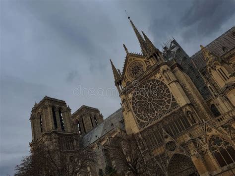 Notre Dame Cathedral In France Against A Backdrop Of Cloudy Skies Stock