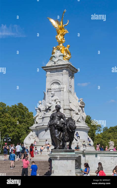 Tourists At The Golden Statue On The Queen Victoria Memorial At