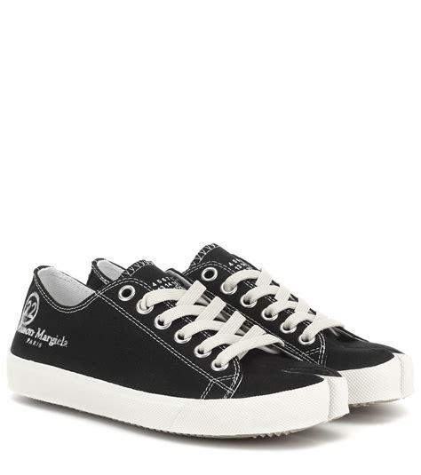 A high top construction with the signature split toe detail for a unique look. Maison Margiela Tabi Canvas Sneakers in Black - Save 18% ...