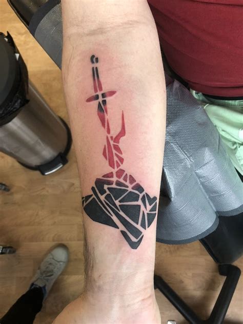 Got my first tattoo! It’s a dark souls bonfire but as geometric shapes