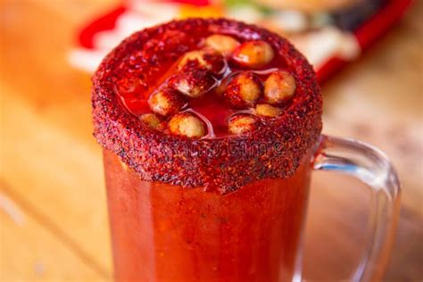 Michelada Beer With Tomato Juice Clamato With Beer On Wooden Table Mexican Drink Stock Photo