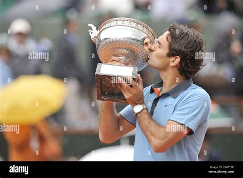 switzerland s roger federer kisses the trophy following his victory during the men s singles