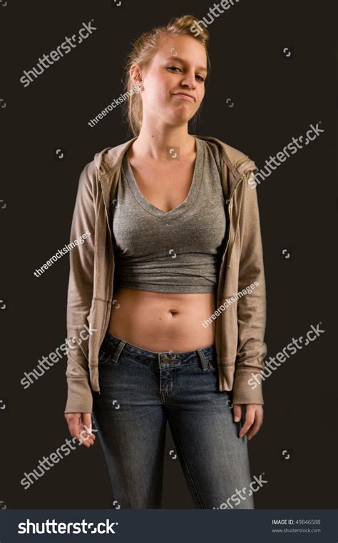 Hip Teen Girl With Attitude And Navel Piercing Stock Photo