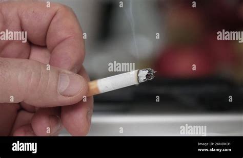 Smoking And Extinguishing A Cigarette In The Ashtray Closeup Shooting