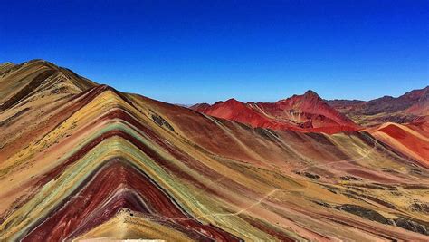 When a ray of light enters a raindrop, it bends and gets separated into its constituent colors. Rainbow Mountain Peru: Why does it have those amazing ...