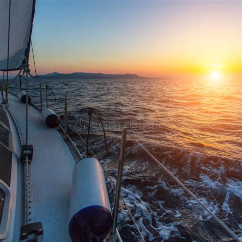 Sailing Yacht Boat In The Sea During Amazing Sunset Travel Stock