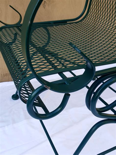 Well Made Metal Chairs That Also Come With A Matching Green Cushion