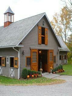 Timing the painting of your wooden windows. Horse Barn Stables Grey with Stained wood doors and ...