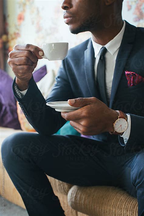 Close Up Of Elegant Black Man Sitting In Stylish Living Room And