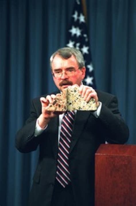 Lee Evey Holds Up Cross Sections Of Concrete From The Pentagon Showing