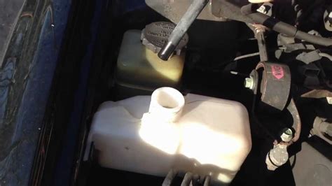 Open your hood and locate your radiator and coolant reservoir. How-to Check & Refill Engine Coolant Antifreeze - YouTube