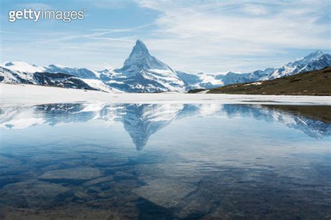 Swiss Alps Matterhorn Mountain Landscape With Reflection On Melting