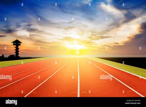 Running Track And Sunrise Background Stock Photo Alamy