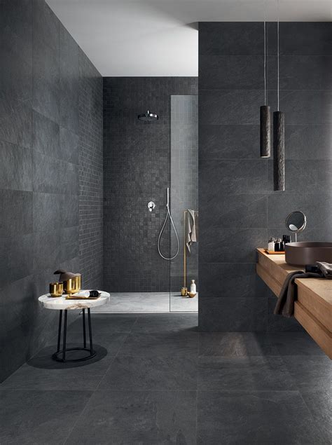 Slate bathroom tile is dense, durable, has a fine grain and comes in a variety of color combinations. Atmospheric, modern bathroom featuring walk in shower and ...