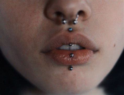 A Woman S Nose With Piercings On It