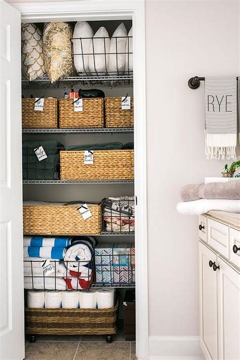 Collection of the best walk in closet design ideas. Organized Linen Closet - Transitional - Bathroom