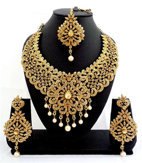 Punjabi jewellery 2018 latest designs. Buy Designer golden stone bridal necklace set with maang ...