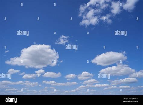 Bright Blue Sky With Clouds To The Horizon Stock Photo Alamy