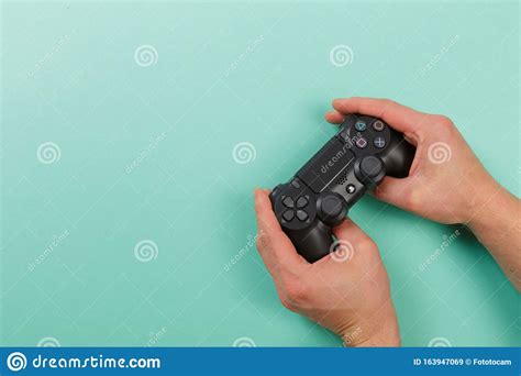 Russia October 24 2019 Male Hands Holding A Ps4 Controller Sony