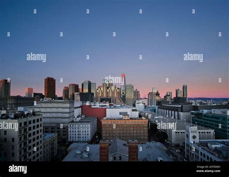 Drone View Of Illuminated Metropolitan City With Skyscrapers Against