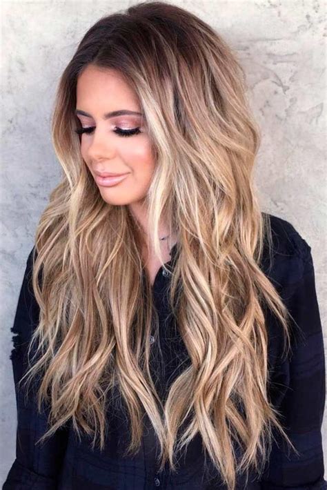 Long, layered hair curled into waves is always a luscious and popular choice, but even more so when colored with caramel ombre against dark roots. 15 Inspirations of Long Hairstyles Lots Of Layers