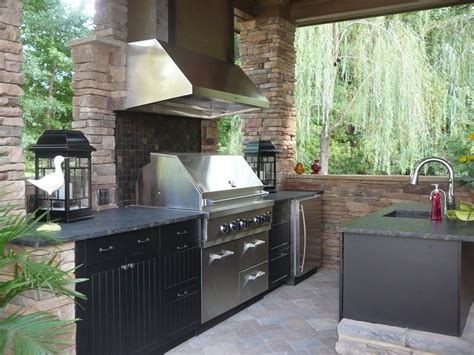 In this space, wood and simple brick complement the small space, providing prep areas and a base for the grill. Outdoor Kitchen Showcase Gallery - Outdoor Kitchen CabinetsOutdoor Kitchen Cabinets