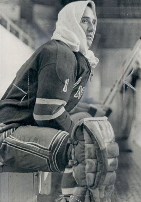 An Old Black And White Photo Of A Woman In Hockey Gear